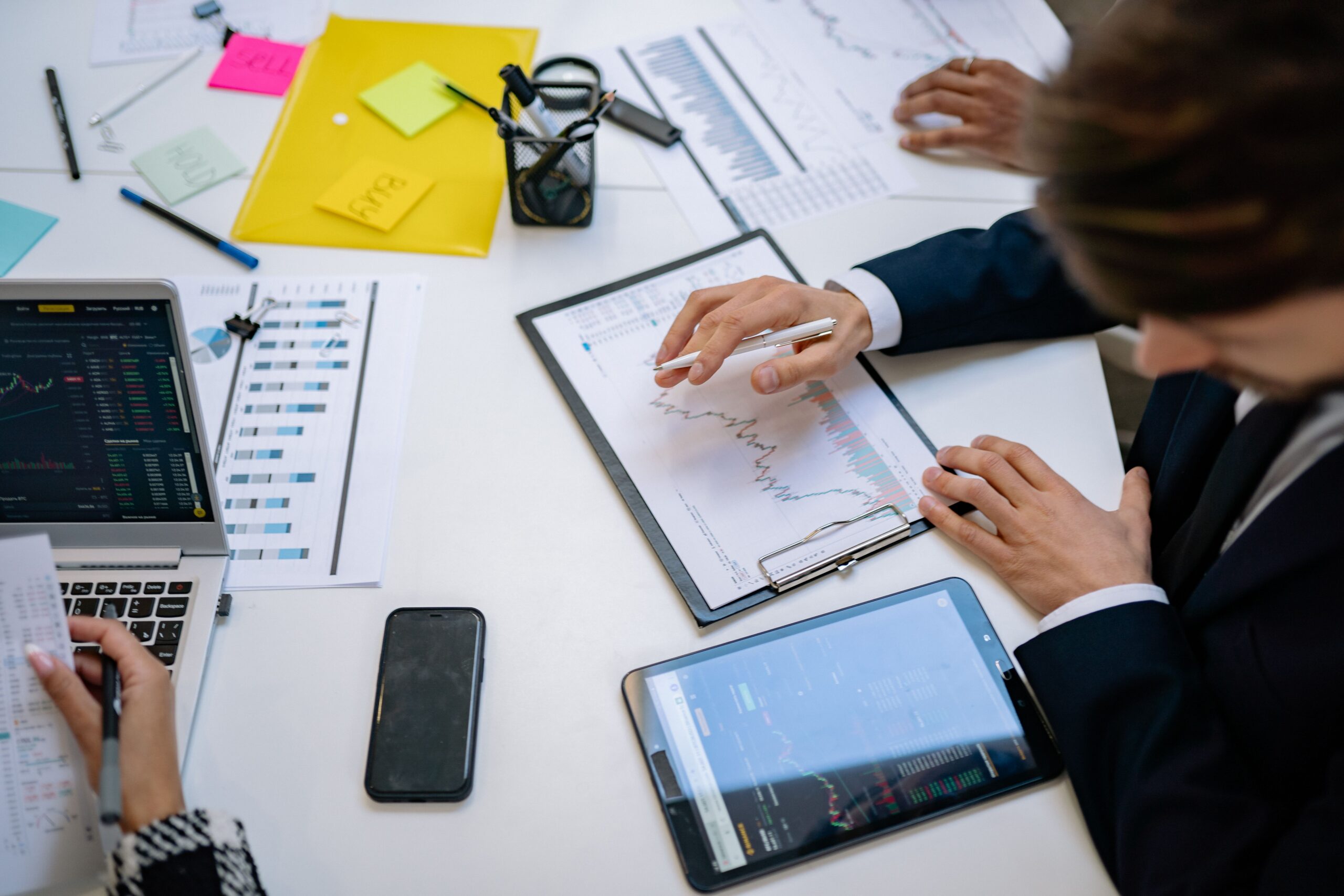 Business reports, a calculator, and financial figures